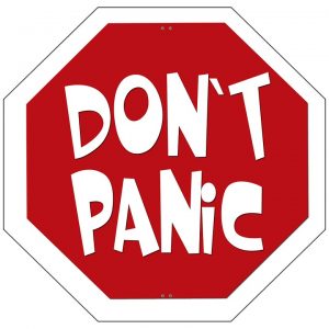An octagon sign that says 'Don't Panic'