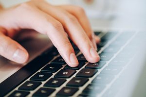 hand typing on the laptop